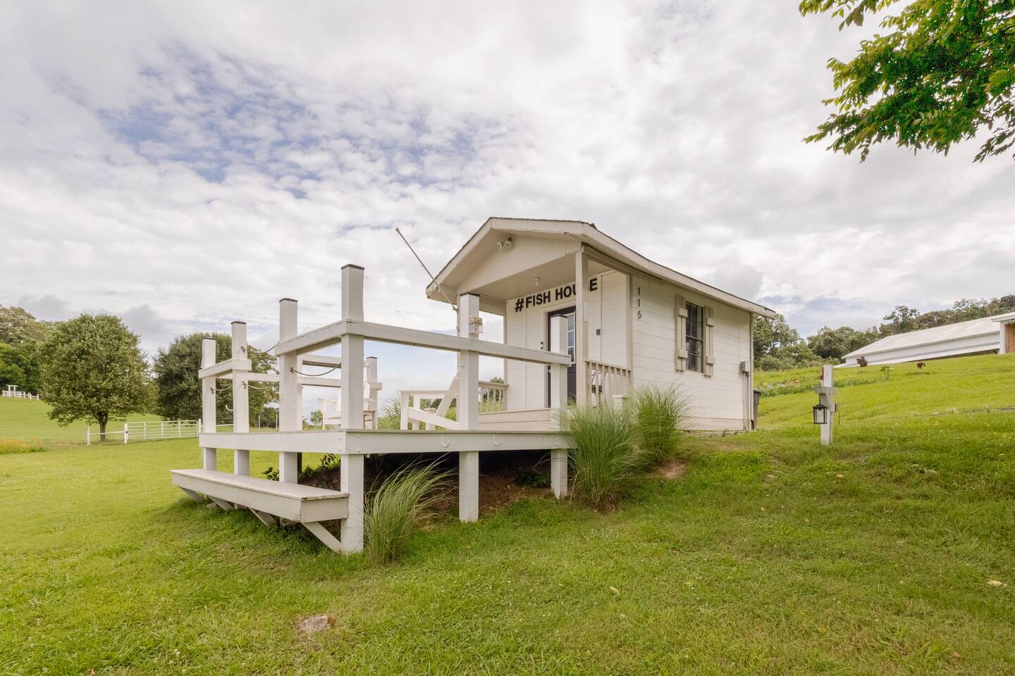FishHouse Tiny Home at Cedar Pond Farms — lakeside tiny home lodging on the farm, with the Highland herd a short walk away.